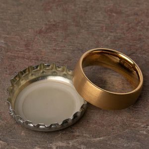 Open Bottles with the Dumbledore Gold Tungsten Carbide Mens Wedding Ring